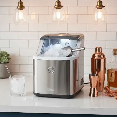 GE Profile Opal 2.0 Nugget Ice Maker on a modern home bar countertop, producing chewable ice
