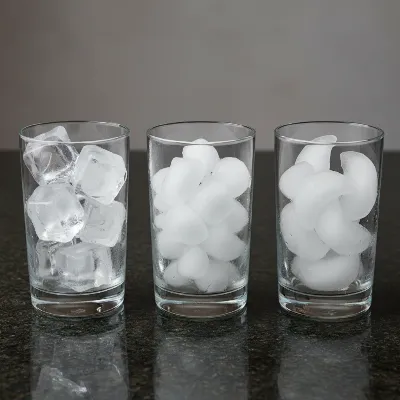 A side-by-side comparison of different ice types (clear cube, nugget, crescent) from under counter ice makers, highlighting their unique shapes and textures in separate glasses. 